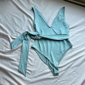 Deep v green body suit with waist tie